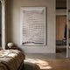 Elorium White Wave Hand-Painted Wood Relief 3D Wall Art by Giant Sculptures, mounted on a beige plaster bedroom wall above a bedside table with paper lamp.