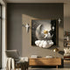 3D MoonSail Astronaut Galaxy Wall Art by Giant Sculptures displayed in a modern living room above a wooden console, flanked by white star accents on a grey wall.