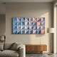 Elysia Geometric Pastel Gradient Wood Relief 3D Wall Art by Giant Sculptures mounted above a wooden sideboard in a neutral living room with linen sofa and floor lamp.