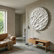 Orenda Organic Wave White Wood Relief 3D Wall Art mounted above an oak console in a minimalist living room with a tan leather sofa and floor lamp.