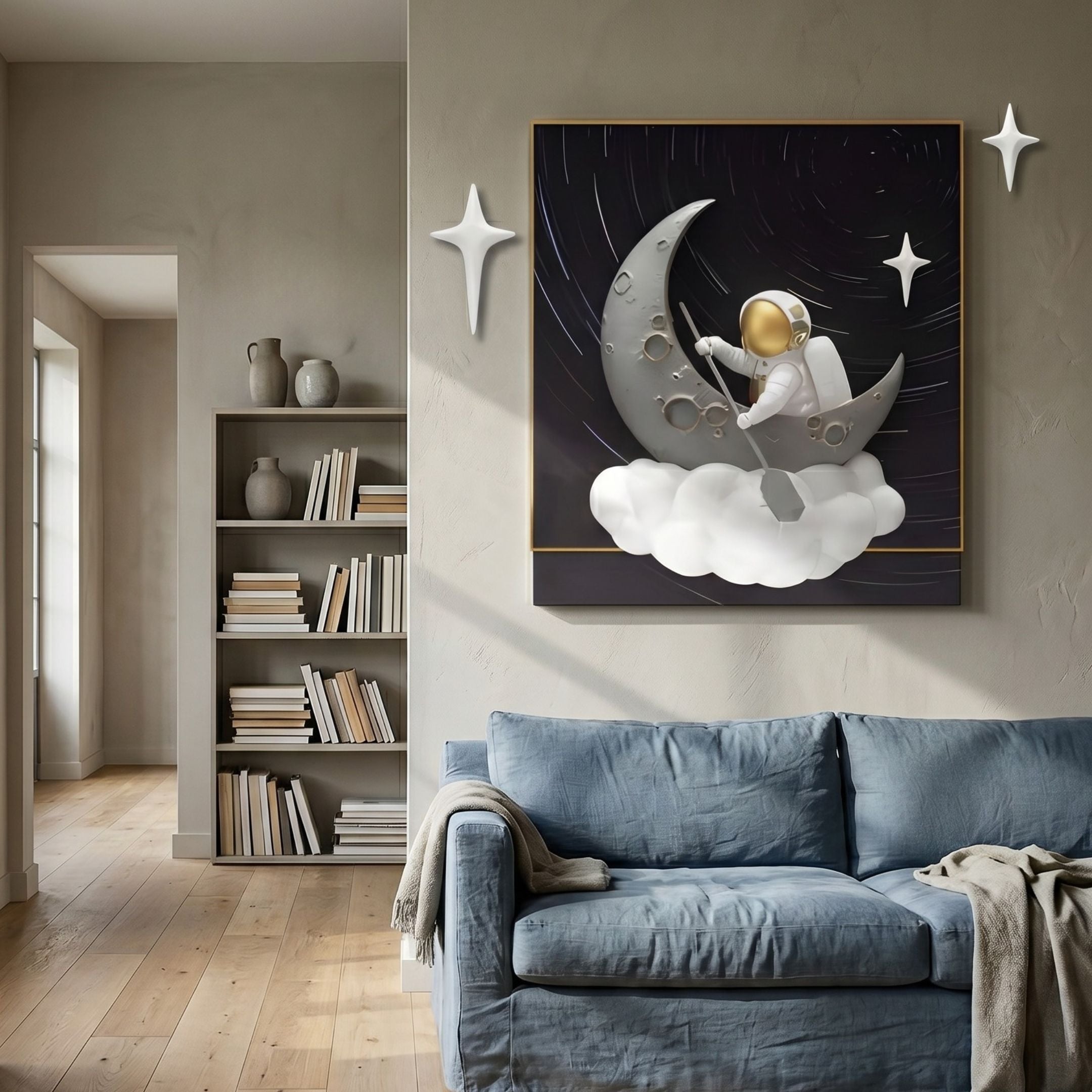 3D MoonSail Astronaut Dark Swirl Wall Art by Giant Sculptures displayed above a blue sofa, flanked by white star accents, with a bookshelf and hallway nearby.