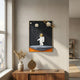White 3D Stellar Astronaut Planet Balloons Wall Art by Giant Sculptures, displayed above a wooden console with a pampas vase and brass astrolabe in a sunlit room.