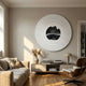 Ventus Onyx Strata Wood Carving 3D LED Wall Art by Giant Sculptures, mounted above a low console with pampas grass in a neutral living room with a leather lounge chair.