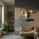 White and gold astronaut 3D wall art by Giant Sculptures, mounted on a grey wall above an olive sofa with planets orbiting around a floating rock base.
