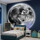 Cosmos Astronaut Adventure UV Wood Carving LED Wall Art by Giant Sculptures mounted on a navy bedroom wall above a teal kids' bed with plush toys.
