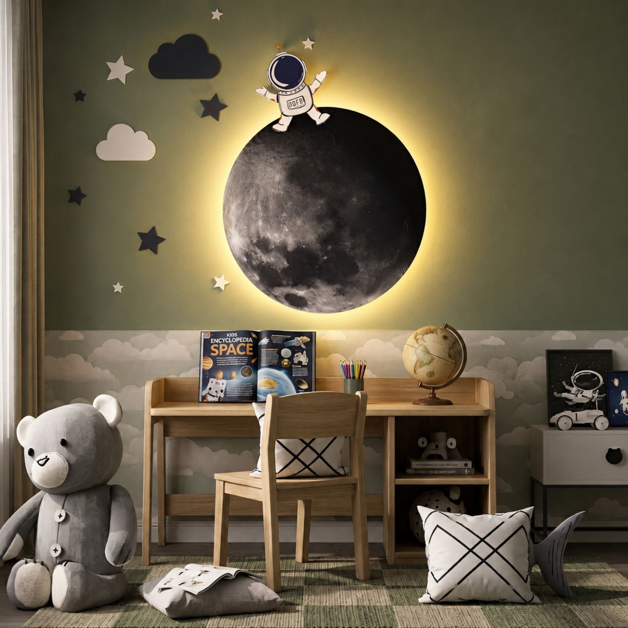 Cosmos Astronaut Dream UV Wood Carving LED Wall Art by Giant Sculptures, with a waving astronaut atop a backlit moon and stars, displayed above a child's desk.