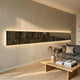 Radiance Charcoal Gold Canvas LED Wall Art mounted horizontally above a grey sofa and wooden coffee table, glowing with warm backlight in a modern living room.