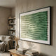 Elytrum Green Gradient Hand-Painted Wood Relief 3D Wall Art by Giant Sculptures in a black frame above a console table, beside a bookshelf and armchair.
