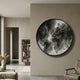 Giant Sculptures Terranova Ash Grey Round Wood Carving 3D Wall Art mounted on a beige wall in a modern living room with bookshelf and armchair.