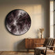 Terranova Mocha Brown Round Wood Carving 3D Wall Art mounted on a cream wall above a walnut sideboard with pampas grass, beside a leather armchair.
