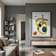 Vitrus Yellow & Blue Abstract Wood Embossed 3D Wall Art by Giant Sculptures displayed above a wooden console in a grey living room with sofa and bookshelf.