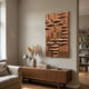 Ombra Brown Hand-Painted 3D Wood Relief Wall Art mounted above a walnut sideboard with pampas grass and lamp, in a neutral living room beside a bookshelf.