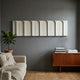 Vireus White Single Panel 3D Wood Relief Wall Art by Giant Sculptures mounted horizontally on a grey wall above a teak sideboard and linen sofa.