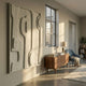 Terravura Rectangular Sage Green I 3D Wood Relief Wall Art by Giant Sculptures displayed in a sunlit hallway above a walnut sideboard with blue armchair.
