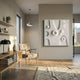 Terravura Square Soft White II 3D Wood Relief Wall Art displayed on a beige wall in a minimalist living room with an oak console, linen armchair, and woven rug.