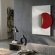 Solvara Red & White Wood Relief 3D Wall Art by Giant Sculptures displayed in a modern living room above a console with a black lamp and vase.