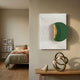 Solvara Green & White Wood Relief 3D Wall Art by Giant Sculptures displayed on a beige hallway wall above a wooden console with a brass knot sculpture, beside a bedroom.