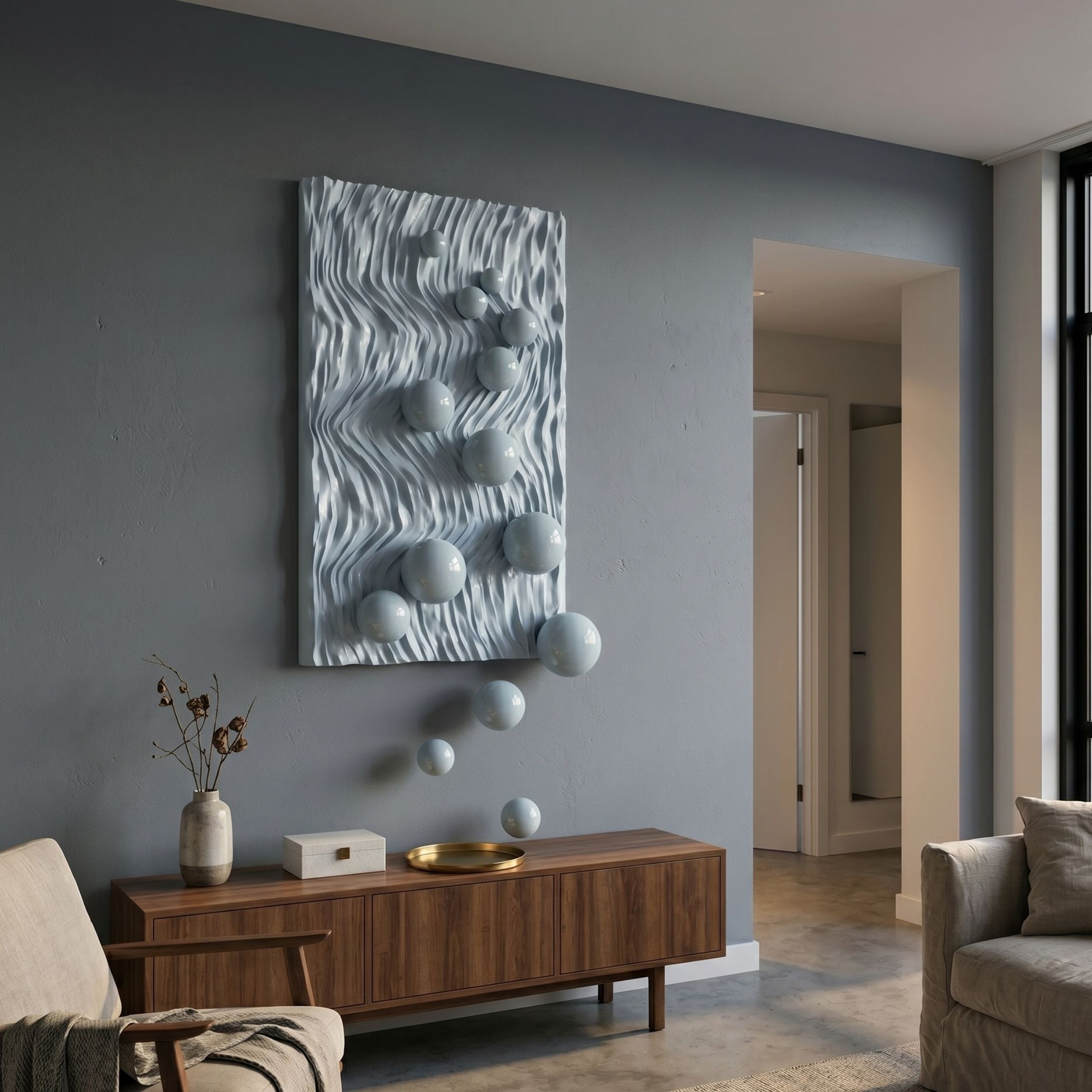 Fluxion Soft Blue 3D Wood Relief Wall Art with metal balls mounted above a walnut sideboard in a grey-toned living room with armchair and vase.