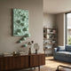 Fluxion Mint Green 3D Wood Relief Wall Art with cascading metal spheres mounted above a walnut sideboard in a modern living room with blue sofa.
