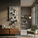 Fluxion Muted Grey 3D Wood Relief Wall Art with carved wave grooves and glossy grey spheres, displayed above a walnut sideboard beside a green armchair.