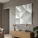 Tessara III White 3D Wood Relief Wall Art by Giant Sculptures displayed above an oak sideboard with a brass lamp, vase of dried grasses, and monstera plant.