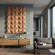 Ondula Textured Earthy Wood Relief 3D Wall Art by Giant Sculptures mounted on a grey living room wall above an oak sideboard with vases beside a grey sofa.