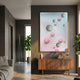 Sphera Gradient 3D Wood Relief Wall Art with grey and pink metal balls mounted above a walnut sideboard in a modern grey-walled living room with plants.