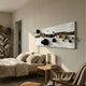 Lustra Black & White 3D Wood Relief Wall Art with black and gold metal ball accents mounted above a bed in a neutral bedroom with a bookshelf nearby.