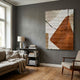 Terracurve III Hand-Painted Sandstone Wood Relief 3D Wall Art by Giant Sculptures displayed on a grey wall above a bookshelf in a living room with linen sofa.