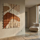 Terracurve I Hand-Painted Sandstone Wood Relief 3D Wall Art by Giant Sculptures in brown, beige and white with a black line, displayed beside a linen lounge chair.