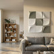 Curvatura White & Olive Grid 3D Wood Relief Wall Art by Giant Sculptures displayed above a grey linen sofa in a neutral living room with a wooden bookshelf.