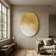 Fluctus Yellow Textured Sandstone Wood Relief 3D Wall Art with gold-to-cream carved grooves displayed on a beige wall above a wooden console in a sunlit living room.
