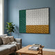 Trelume White, Green & Gold Wavy Wood Relief 3D Wall Art by Giant Sculptures displayed on a blue living room wall above a grey sofa and wooden coffee table.