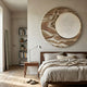Reveria Sandy Beige Abstract Wood Carving 3D Wall Art mounted above a walnut bed with linen bedding, beside a bookshelf and floor mirror in a neutral bedroom.