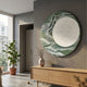 Reveria Sage Green Abstract Wood Carving 3D Wall Art displayed in a modern hallway above an oak sideboard with a vase and potted plant nearby.