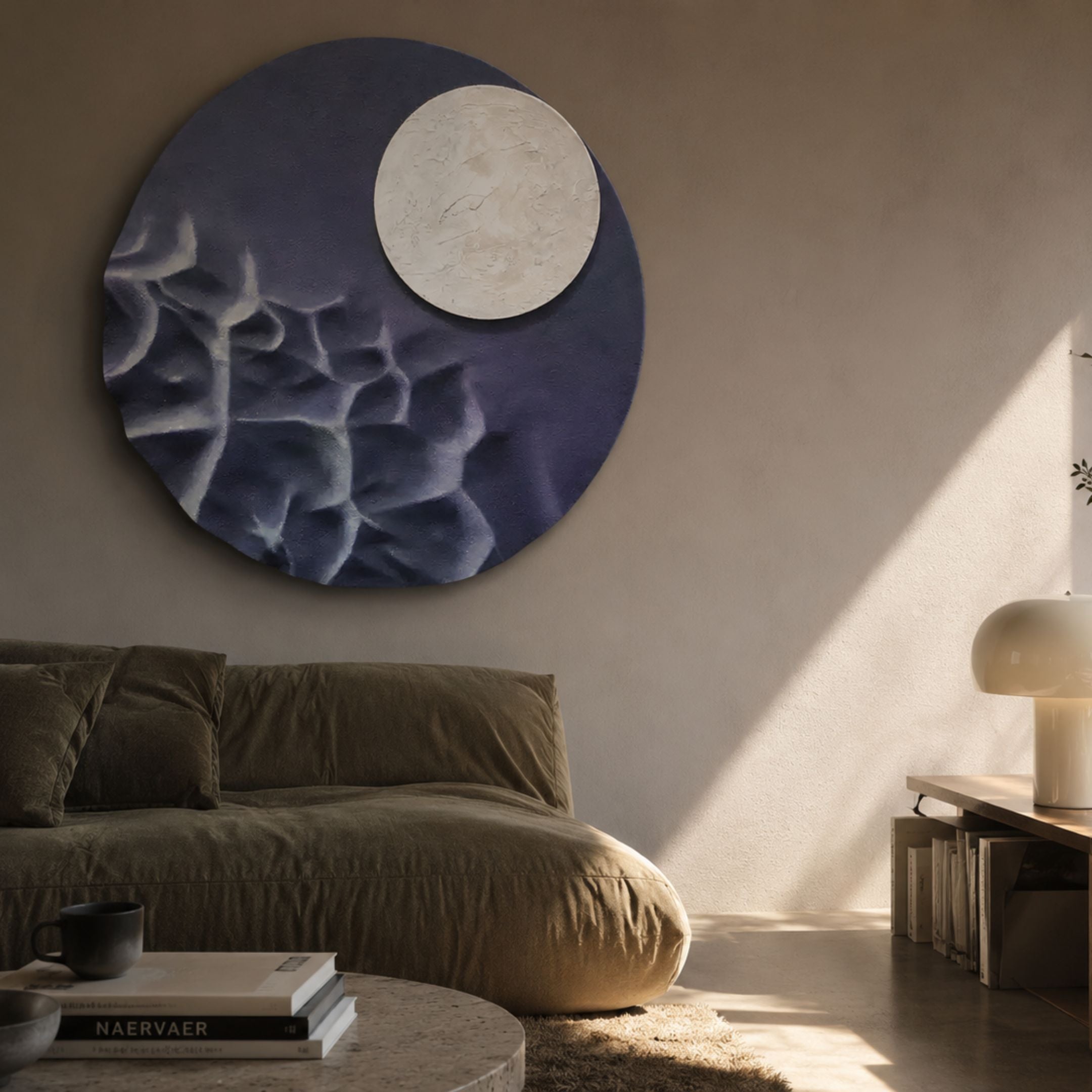 Verve Soft Purple Wood Relief 3D Wall Art by Giant Sculptures, a round bluish-purple panel with a raised white disc, displayed above an olive sofa in a sunlit living room.