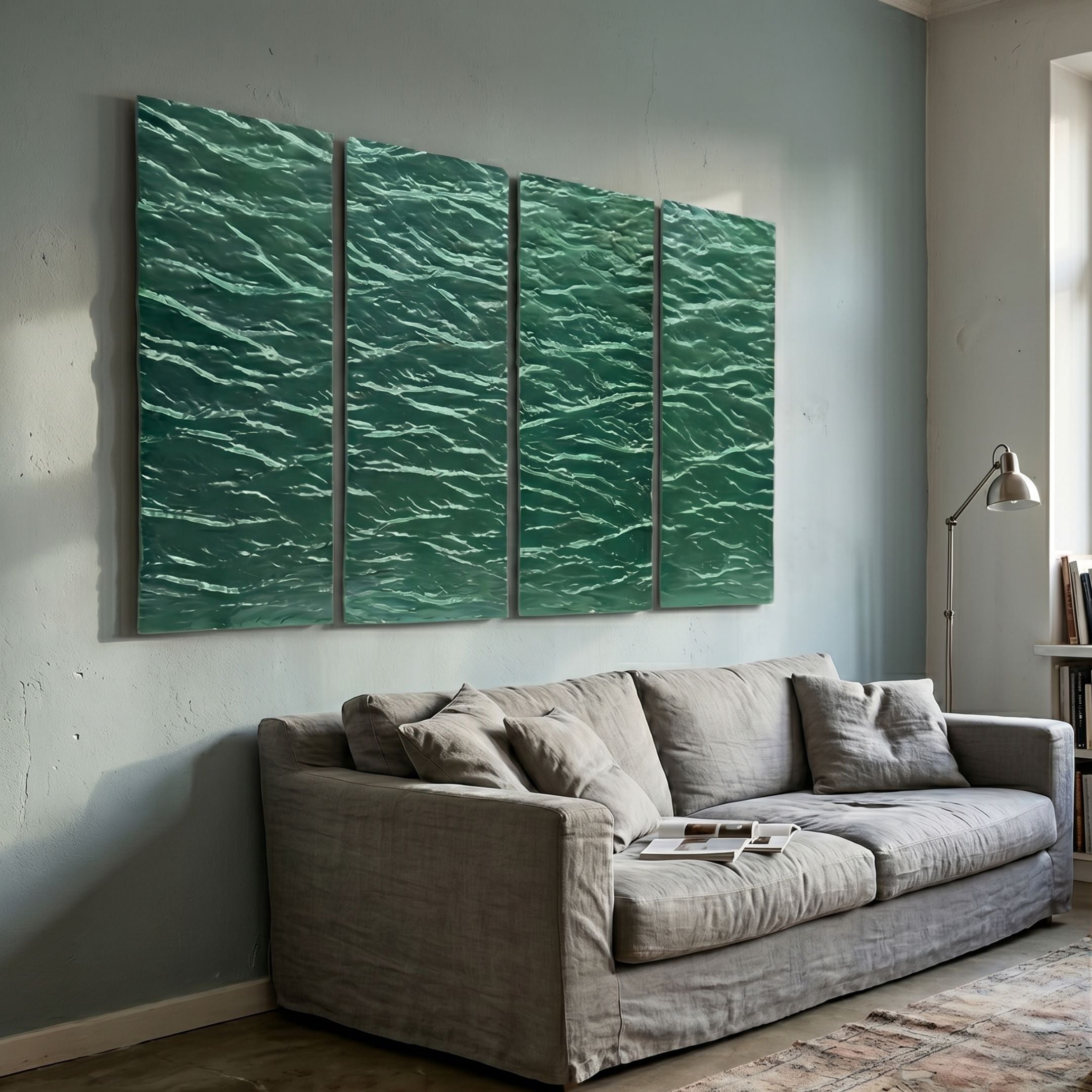 Illume 4-Panel Green Hand-Painted Wood Relief 3D Wall Art by Giant Sculptures displayed above a grey linen sofa in a soft blue-grey living room with floor lamp.