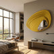 Reflecta Yellow Wood Carving Mirror 3D Wall Art by Giant Sculptures mounted on a pale wall in a modern bedroom with a lounge chair and large window.