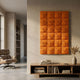 Vellura Orange Textured Wood Relief 3D Wall Art by Giant Sculptures displayed above a wooden console in a modern living room with a leather lounge chair.
