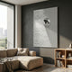 Ondella Silver Ripple II Sandstone Wood Relief 3D Wall Art with concentric silver ripples displayed above a beige sofa in a modern living room with grey walls.