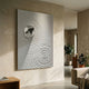 Ondella Silver Ripple I Sandstone Wood Relief 3D Wall Art by Giant Sculptures, displayed on a beige plaster wall in a minimalist living room with potted plants and a neutral sofa.