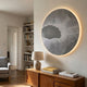 Earthlight Twilight Aura 3D Textured Oil Painting LED Wall Art by Giant Sculptures, round grey piece with white web pattern and warm backlight, above a wooden sideboard.