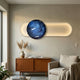 Vitreon 3D Cobalt Blue Crystal Porcelain Wall Art by Giant Sculptures mounted above a mid-century wood sideboard with a pampas vase in a neutral living room.