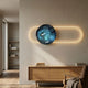 Vitreon 3D Sapphire Crystal Porcelain Wall Art by Giant Sculptures mounted above a wooden sideboard, with the blue crystal disc framed by a glowing gold LED oval.