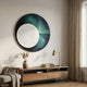 Flaria Emerald 3D LED Wall Art by Giant Sculptures, a round panel with textured white circle on emerald and black, above a wooden console with brass lamp.