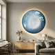 Genesis Frost 3D Resin Crystal Porcelain LED Wall Art by Giant Sculptures, circular blue and white piece backlit above a wooden sideboard in a living room.