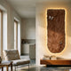 Blossom Warm Terracotta Leather 3D LED Wall Art by Giant Sculptures glowing on a cream wall above a wooden console in a minimalist living room.