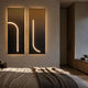 Arcolume III Neutral Gradient Geometric LED Wall Art by Giant Sculptures, two dark panels with glowing arched and curved white LED lines, mounted above a bed.