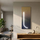 Arcolume II Neutral Gradient Geometric LED Wall Art by Giant Sculptures mounted vertically in a minimalist living room above an oak console with vase and lamp.