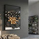 Obscura Black & Gold Geometric 3D Wooden Wall Art by Giant Sculptures mounted on a grey wall in a modern living room beside a black bookshelf.